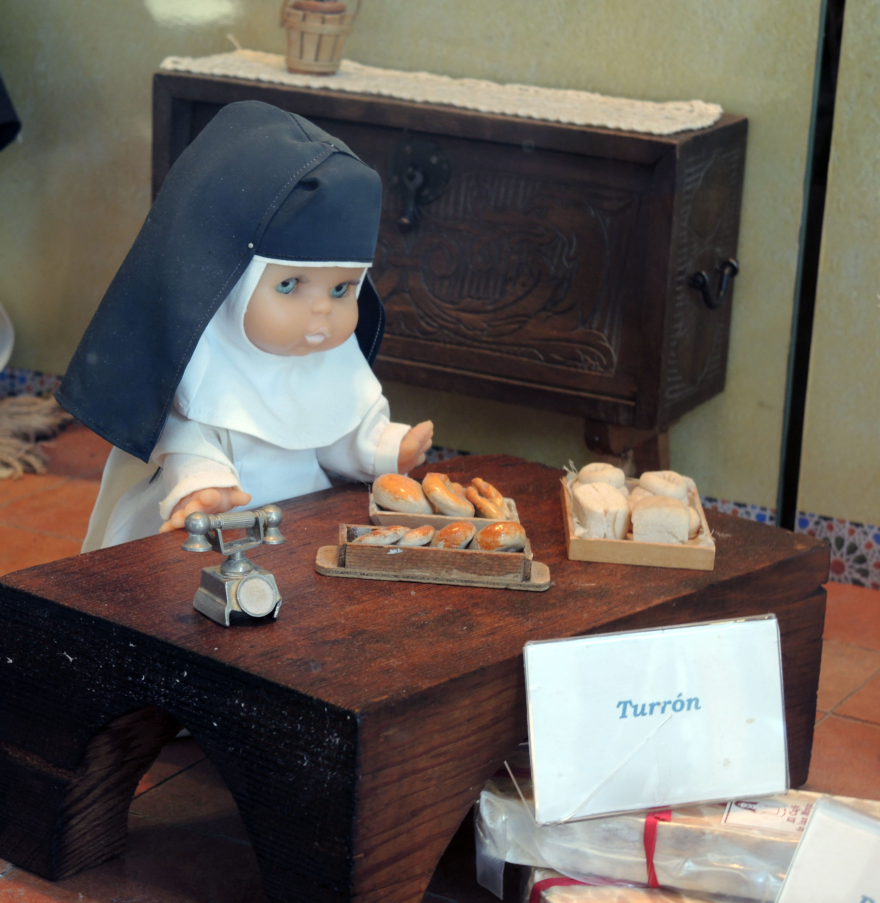 Part of a marzipan shop's window scene, depicting nuns making marzipan 
