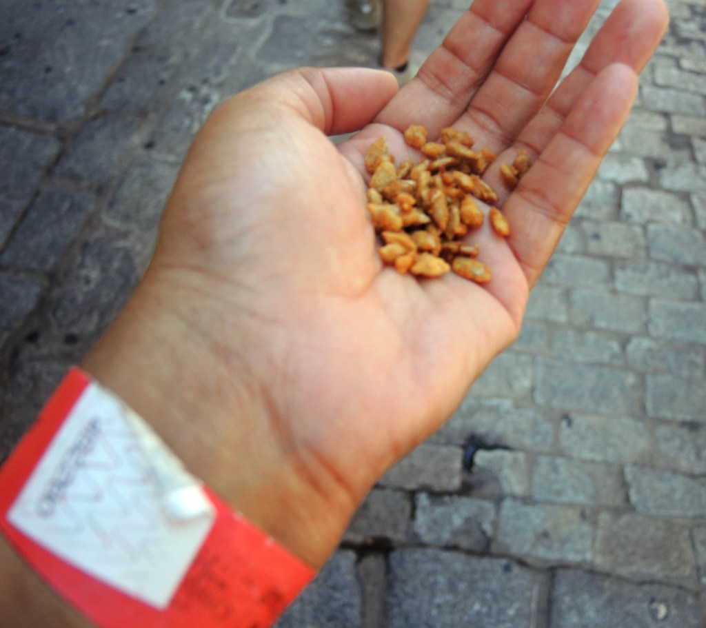 Sampling a honeycomb-like treat n Toledo, Spain